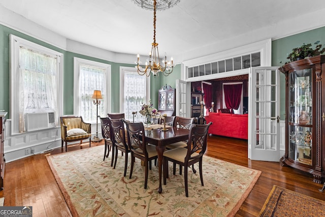 416 Engram St, Montezuma, GA 31063 - dining room featuring a chandelier, hardwood / wood-style floors, and cooling unit