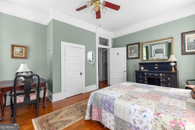 416 Engram St, Montezuma, GA 31063 - bedroom featuring wood finished floors, a ceiling fan, and baseboards