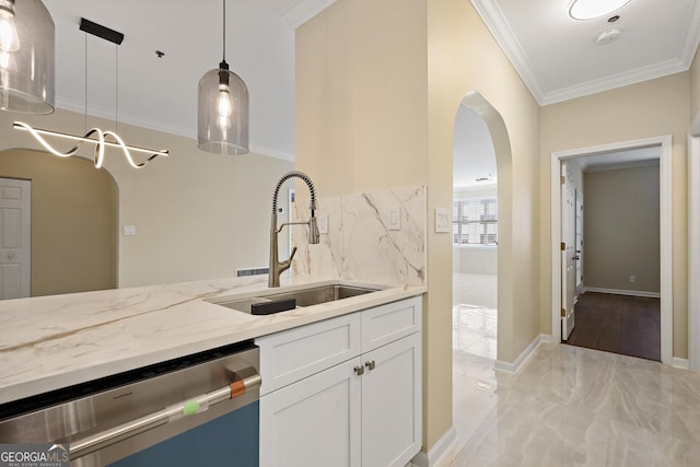 2499 Peachtree Rd Unit 506, Atlanta, GA 30305 - kitchen featuring stainless steel dishwasher, light stone counters, arched walkways, white cabinetry, and crown molding