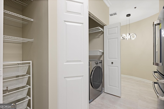 2499 Peachtree Rd Unit 506, Atlanta, GA 30305 - laundry area with washer / clothes dryer and baseboards