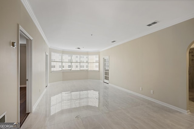 2499 Peachtree Rd Unit 506, Atlanta, GA 30305 - empty room featuring arched walkways, light tile patterned floors, and ornamental molding