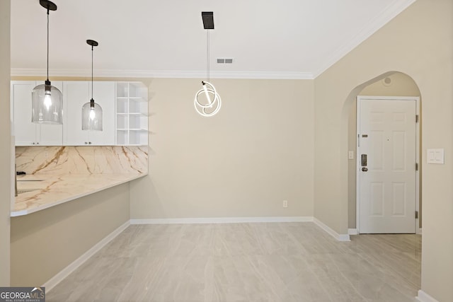 2499 Peachtree Rd Unit 506, Atlanta, GA 30305 - unfurnished dining area with arched walkways and ornamental molding
