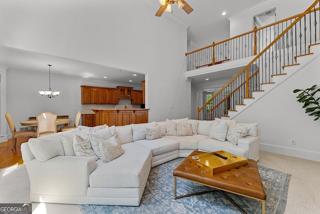 220 Broadmoor Dr, Fayetteville, GA 30215 - living area with ornamental molding, stairs, baseboards, a chandelier, and ceiling fan