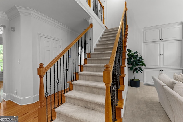 220 Broadmoor Dr, Fayetteville, GA 30215 - staircase featuring crown molding, baseboards, and wood finished floors