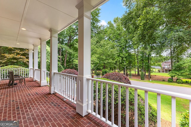 220 Broadmoor Dr, Fayetteville, GA 30215 - porch featuring view of wooded area