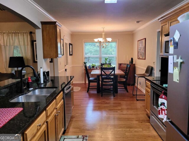 135 Pine Creek Way, Winterville, GA 30683 - dining space featuring a chandelier, dark wood-style floors, baseboards, and crown molding