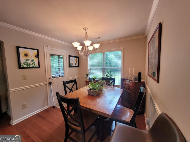 135 Pine Creek Way, Winterville, GA 30683 - dining room with a chandelier, crown molding, and dark wood finished floors
