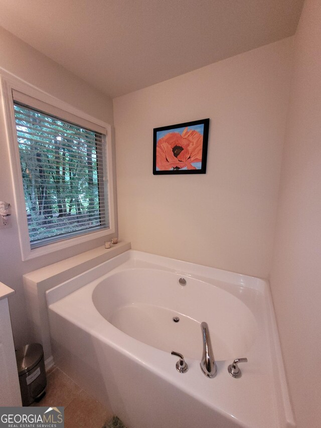 135 Pine Creek Way, Winterville, GA 30683 - full bath featuring a garden tub, tile patterned flooring, and vanity