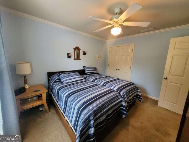 135 Pine Creek Way, Winterville, GA 30683 - carpeted bedroom with crown molding, a closet, a ceiling fan, and baseboards