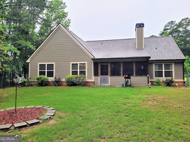 135 Pine Creek Way, Winterville, GA 30683 - rear view of property featuring a shingled roof, a chimney, and a sunroom