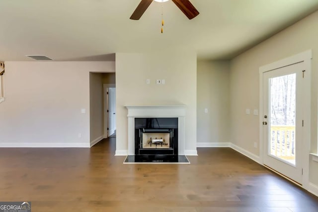 37 Radian Way, Dallas, GA 30132 - unfurnished living room featuring a ceiling fan, wood finished floors, a fireplace, and plenty of natural light