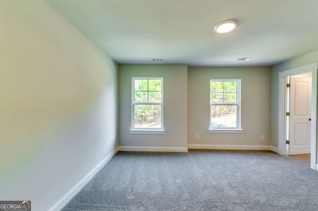 37 Radian Way, Dallas, GA 30132 - spare room with baseboards, carpet floors, and plenty of natural light