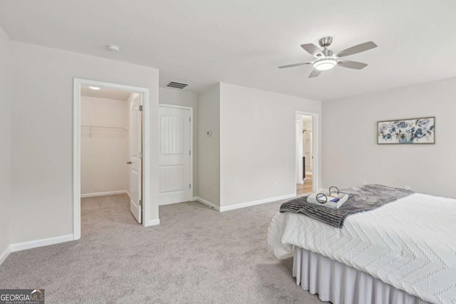 236 Arbor Creek Dr, Dallas, GA 30157 - bedroom featuring a spacious closet, carpet, baseboards, and ceiling fan