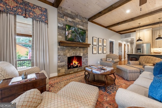 547 Toccoa River Ln, Mineral Bluff, GA 30559 - living area featuring a stone fireplace, wood finished floors, and wooden ceiling with exposed beams