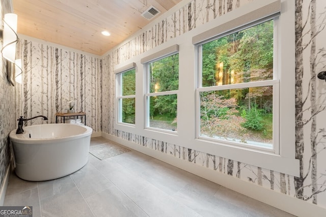 547 Toccoa River Ln, Mineral Bluff, GA 30559 - bathroom featuring a freestanding tub, plenty of natural light, wooden ceiling, wallpapered walls, and recessed lighting