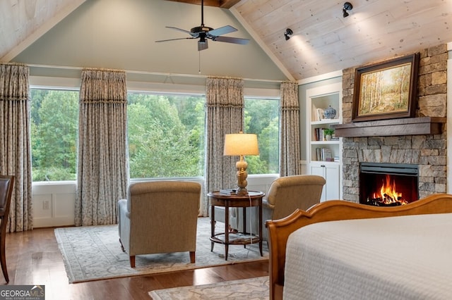 547 Toccoa River Ln, Mineral Bluff, GA 30559 - bedroom featuring wood finished floors, a stone fireplace, wooden ceiling, and multiple windows