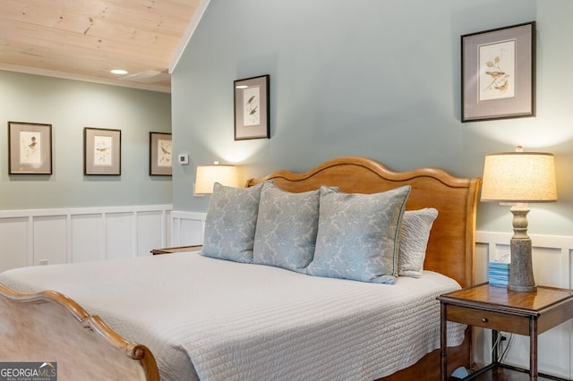 547 Toccoa River Ln, Mineral Bluff, GA 30559 - bedroom featuring crown molding, wainscoting, wood ceiling, and a decorative wall