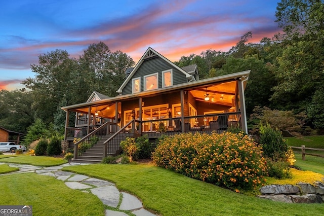 547 Toccoa River Ln, Mineral Bluff, GA 30559 - back of property at dusk featuring a porch and stairs