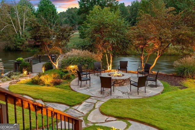 547 Toccoa River Ln, Mineral Bluff, GA 30559 - view of green lawn with a fire pit, a water view, and a patio
