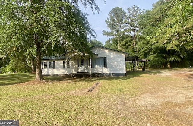 8020 Ga Highway 272, Sandersville, GA 31082 - view of front of home with a front lawn and crawl space