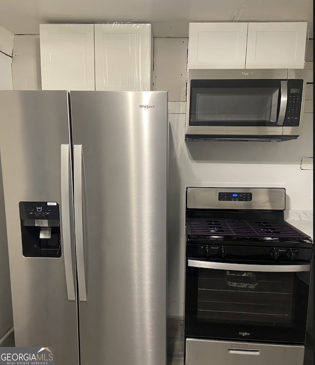 8020 Ga Highway 272, Sandersville, GA 31082 - kitchen featuring stainless steel appliances and white cabinets