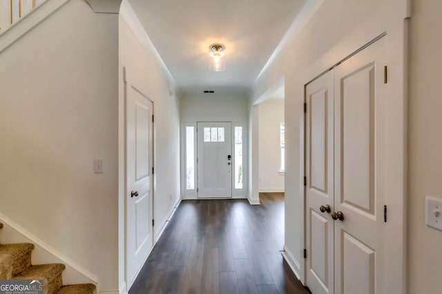 537 Principal Meridian Dr, Dallas, GA 30132 - entryway with dark wood-style floors, stairs, and baseboards