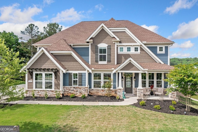 2121 Harmony Dr, Canton, GA 30115 - view of front of home with a front lawn, roof with shingles, and stone siding
