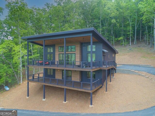 146 Mill Ridge Rd, Hiawassee, GA 30546 - view of front of property featuring a wooden deck and a wooded view