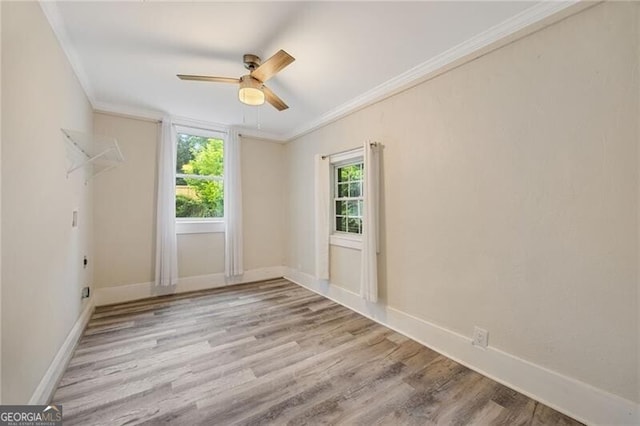 1268 Ladd St SW, Atlanta, GA 30310 - spare room featuring crown molding, ceiling fan, wood finished floors, and baseboards