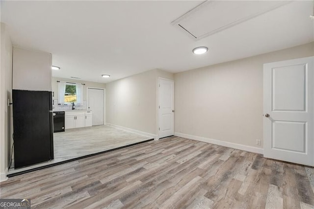 1268 Ladd St SW, Atlanta, GA 30310 - unfurnished living room with light wood finished floors and baseboards