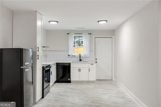 1268 Ladd St SW, Atlanta, GA 30310 - kitchen with black appliances, a sink, tasteful backsplash, white cabinetry, and light countertops