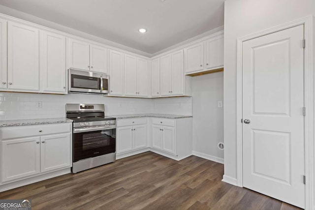 427 Buck Trl, Dallas, GA 30132 - kitchen featuring appliances with stainless steel finishes, white cabinetry, and recessed lighting