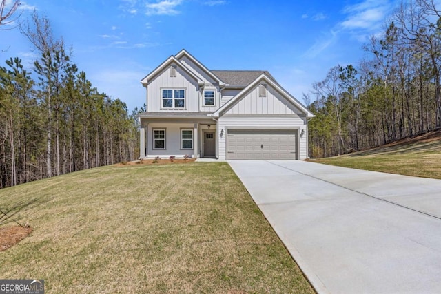 427 Buck Trl, Dallas, GA 30132 - view of front of house featuring driveway, a front lawn, board and batten siding, an attached garage, and a porch