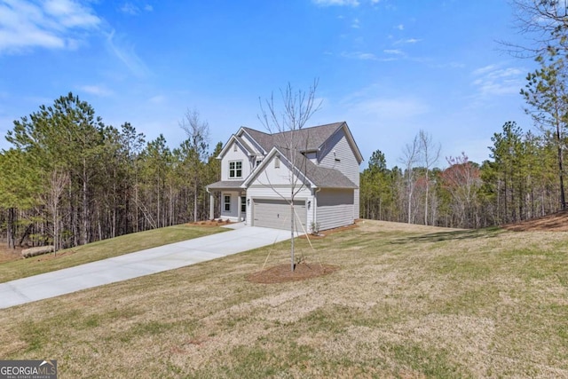 427 Buck Trl, Dallas, GA 30132 - view of home's exterior featuring concrete driveway, an attached garage, a yard, and a forest view
