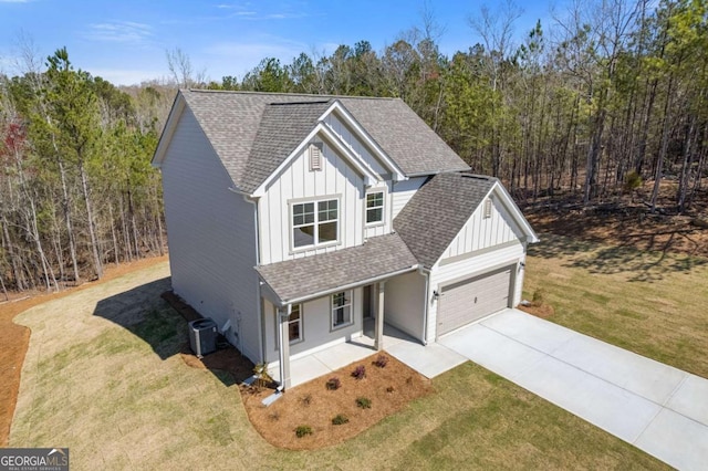 427 Buck Trl, Dallas, GA 30132 - view of front of property featuring board and batten siding, a porch, and roof with shingles