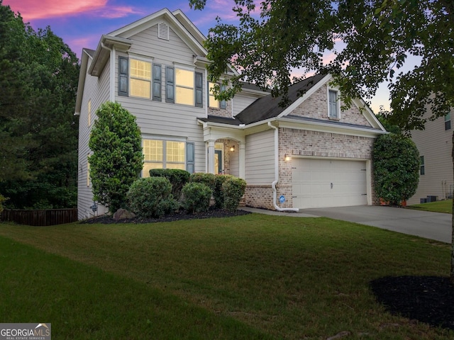 6160 Overleaf Ter, Cumming, GA 30040 - traditional-style home featuring brick siding, concrete driveway, a front yard, and an attached garage