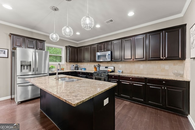 6160 Overleaf Ter, Cumming, GA 30040 - kitchen with appliances with stainless steel finishes, a sink, light stone countertops, pendant lighting, and dark wood-type flooring