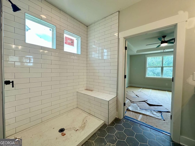 6819 Cambridge Dr, Flowery Branch, GA 30542 - full bath with tile patterned floors, tiled shower, and ceiling fan