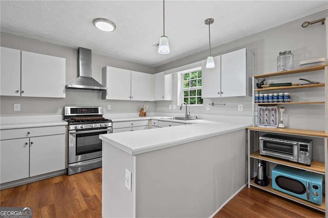 1047 Woodsong Pass Ct, Lawrenceville, GA 30043 - kitchen with stainless steel gas stove, a sink, wall chimney exhaust hood, and white cabinets