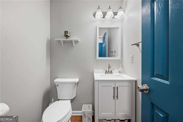 1047 Woodsong Pass Ct, Lawrenceville, GA 30043 - bathroom with toilet and vanity