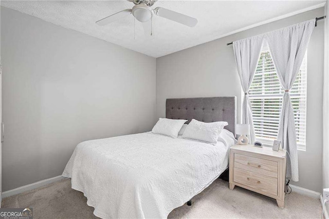 1047 Woodsong Pass Ct, Lawrenceville, GA 30043 - bedroom featuring light colored carpet, baseboards, and ceiling fan