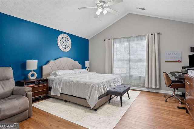 1047 Woodsong Pass Ct, Lawrenceville, GA 30043 - bedroom with wood finished floors, an office area, lofted ceiling, a ceiling fan, and baseboards