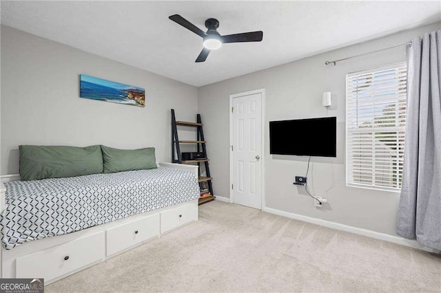 1047 Woodsong Pass Ct, Lawrenceville, GA 30043 - carpeted bedroom featuring baseboards and a ceiling fan