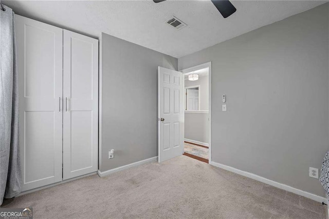 1047 Woodsong Pass Ct, Lawrenceville, GA 30043 - unfurnished bedroom featuring carpet floors, baseboards, and a ceiling fan