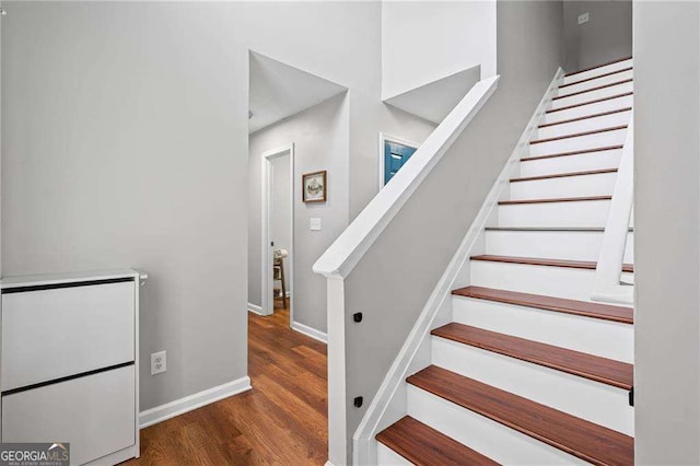 1047 Woodsong Pass Ct, Lawrenceville, GA 30043 - stairway featuring wood finished floors and baseboards