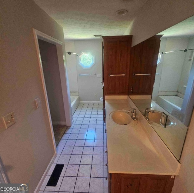 359 Hoyt St, Cornelia, GA 30531 - bathroom featuring vanity, tile patterned flooring, baseboards, toilet, and a textured ceiling