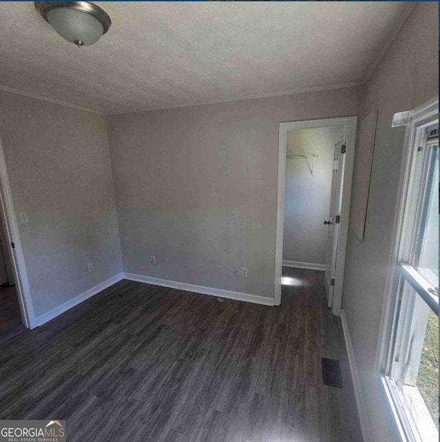 359 Hoyt St, Cornelia, GA 30531 - unfurnished room with dark wood-style floors, baseboards, and a textured ceiling
