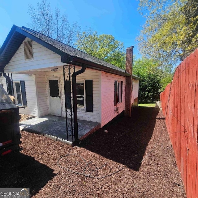 359 Hoyt St, Cornelia, GA 30531 - view of property exterior featuring a chimney and a patio area