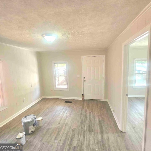 359 Hoyt St, Cornelia, GA 30531 - entrance foyer with a textured ceiling, wood finished floors, ornamental molding, and baseboards