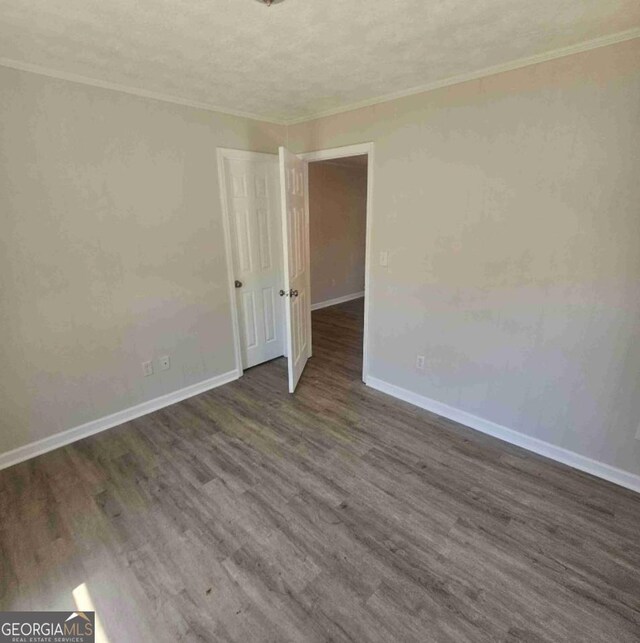359 Hoyt St, Cornelia, GA 30531 - spare room featuring ornamental molding, baseboards, wood finished floors, and a textured ceiling
